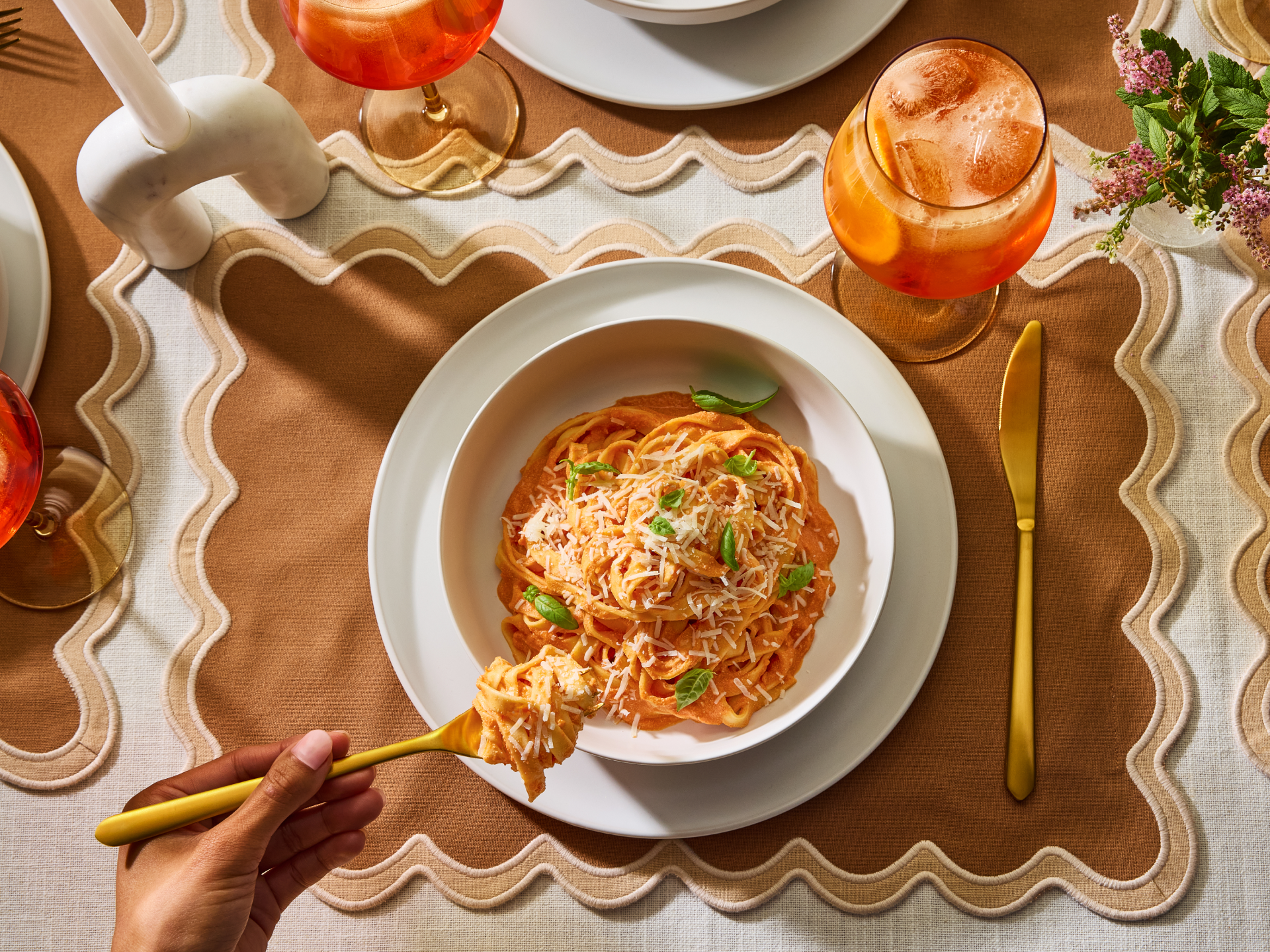A person eating fresh spaghetti. 