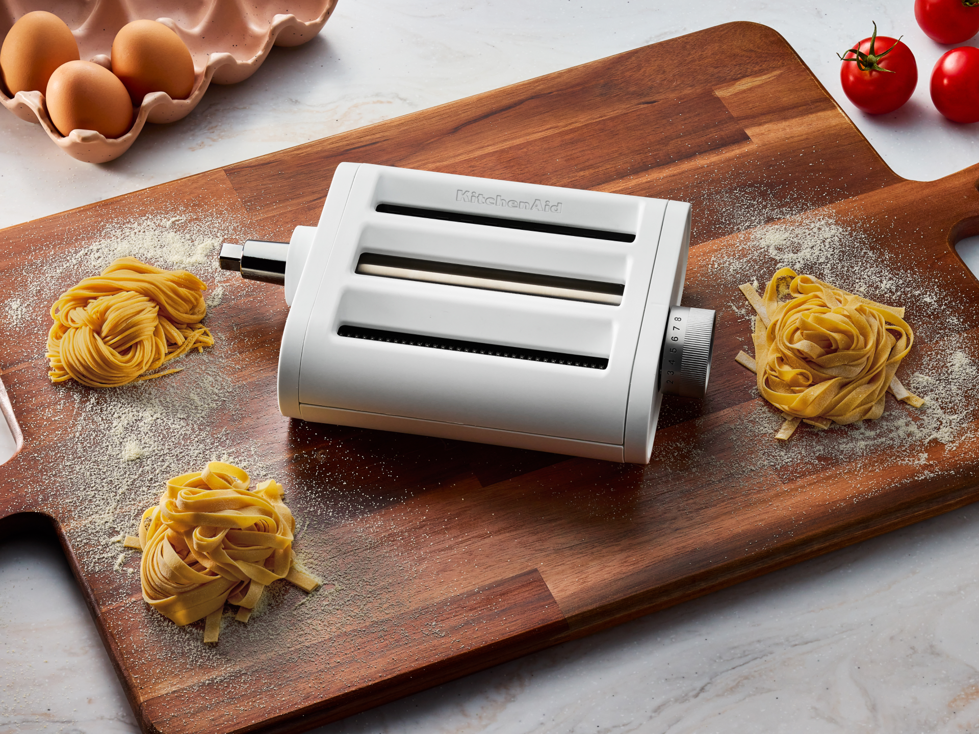 The 3-in-1 pasta attachment on a cutting board. 