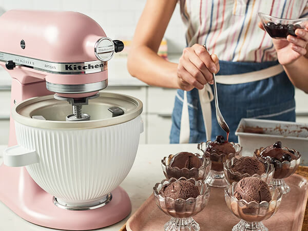 Scoops of gelato in glasses next to a KitchenAid<sup>®</sup> stand mixer. 