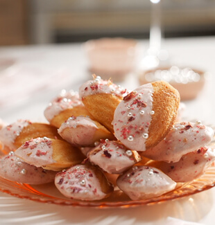 A pink KitchenAid® stand mixer with a stainless steel bowl