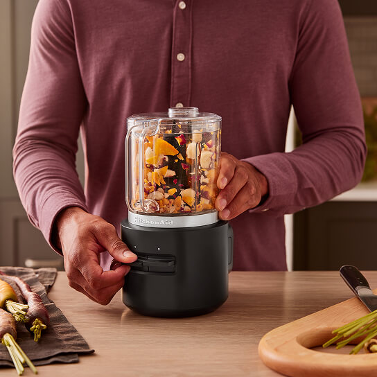 A person using a KitchenAid® food processor