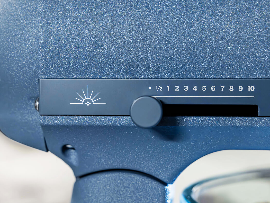 Close-up of the speed dial and sparkle emblem on a Luminaire stand mixer