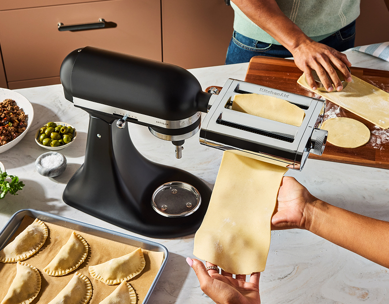 A person making pasta with the 3-in1 pasta attachment