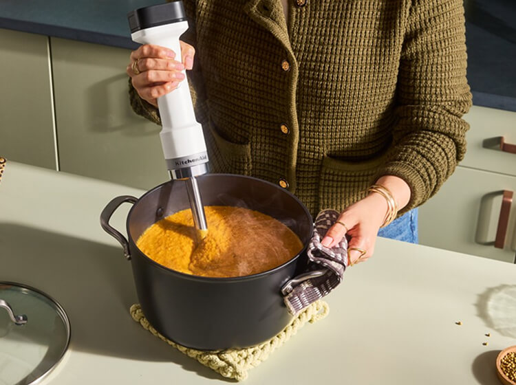 A Porcelain White KitchenAid® hand blender.