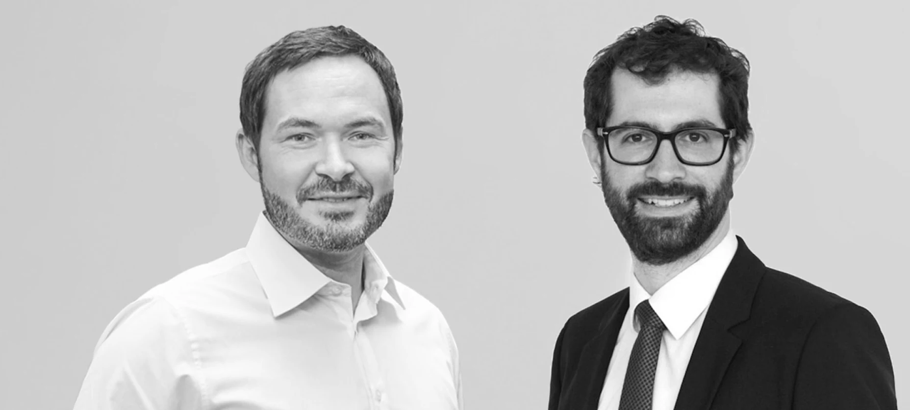 Schwarz-Weiß-Portraitbild – links Martin Schneider, Geschäftsführer der Allvest GmbH und rechts Dr. Andreas Ott, Head of Investment Strategy der Allianz Investment Management SE.