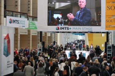 Presentations on the IMTS+ Main Stage at IMTS 2024 include executives from BlueForge Alliance, Google Cloud, Hexagon Manufacturing Intelligence, Microsoft, Manufacturing USA, RFK Racing, Siemens USA, Strategic Submarines, and (shown here) Douglas K. Woods, president of AMT – The Association For Manufacturing Technology.