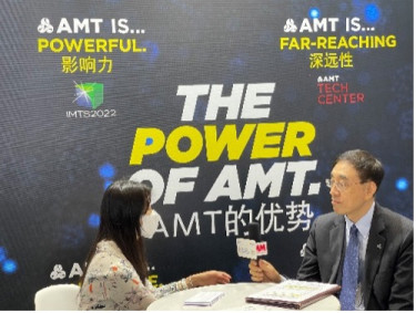 Li Xingbin being interviewed by Vogel Media at the AMT Booth