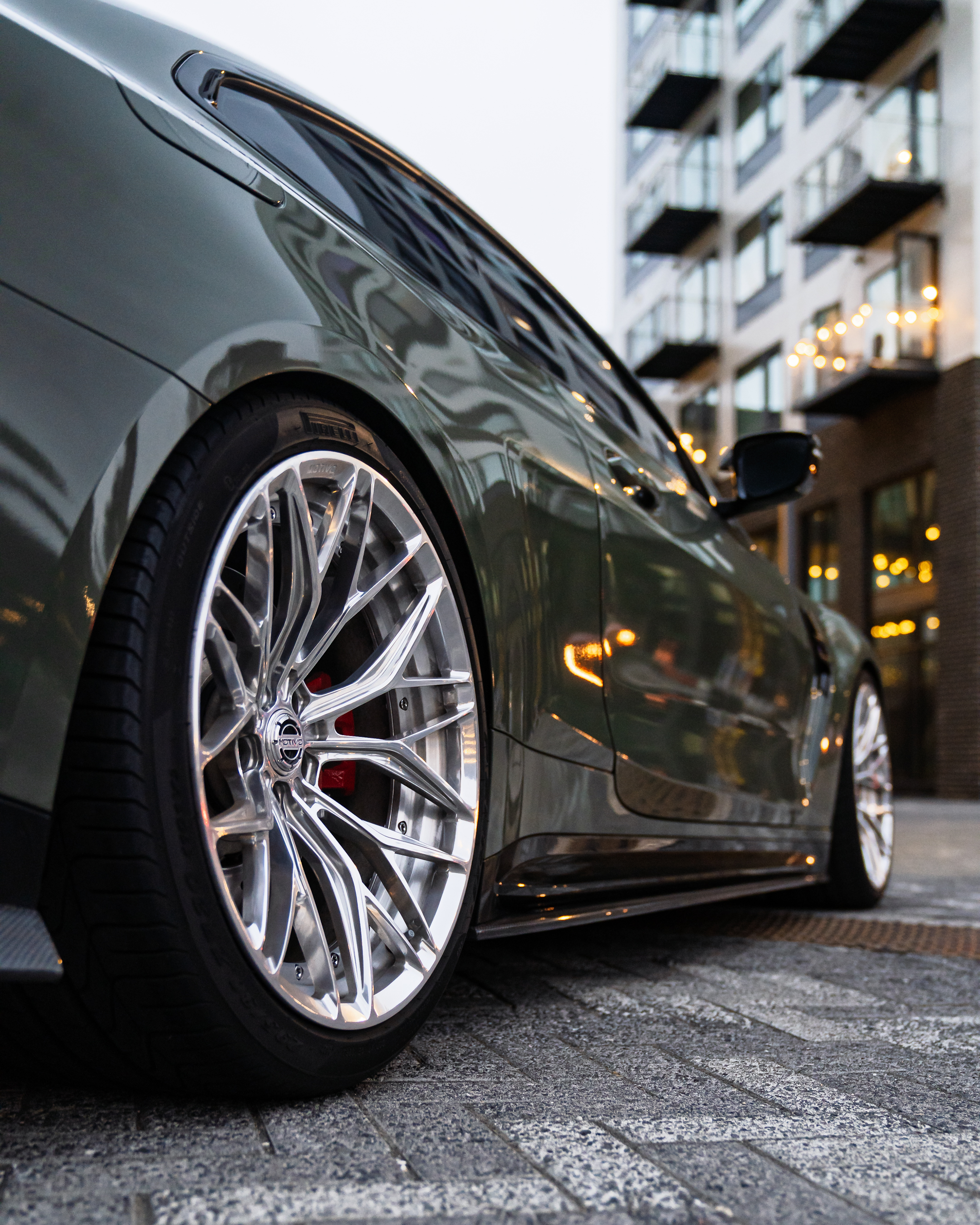BMW M4 with Motivo Forged CS-C custom wheels in gloss polished clear face and brushed clear barrel rear wheel view