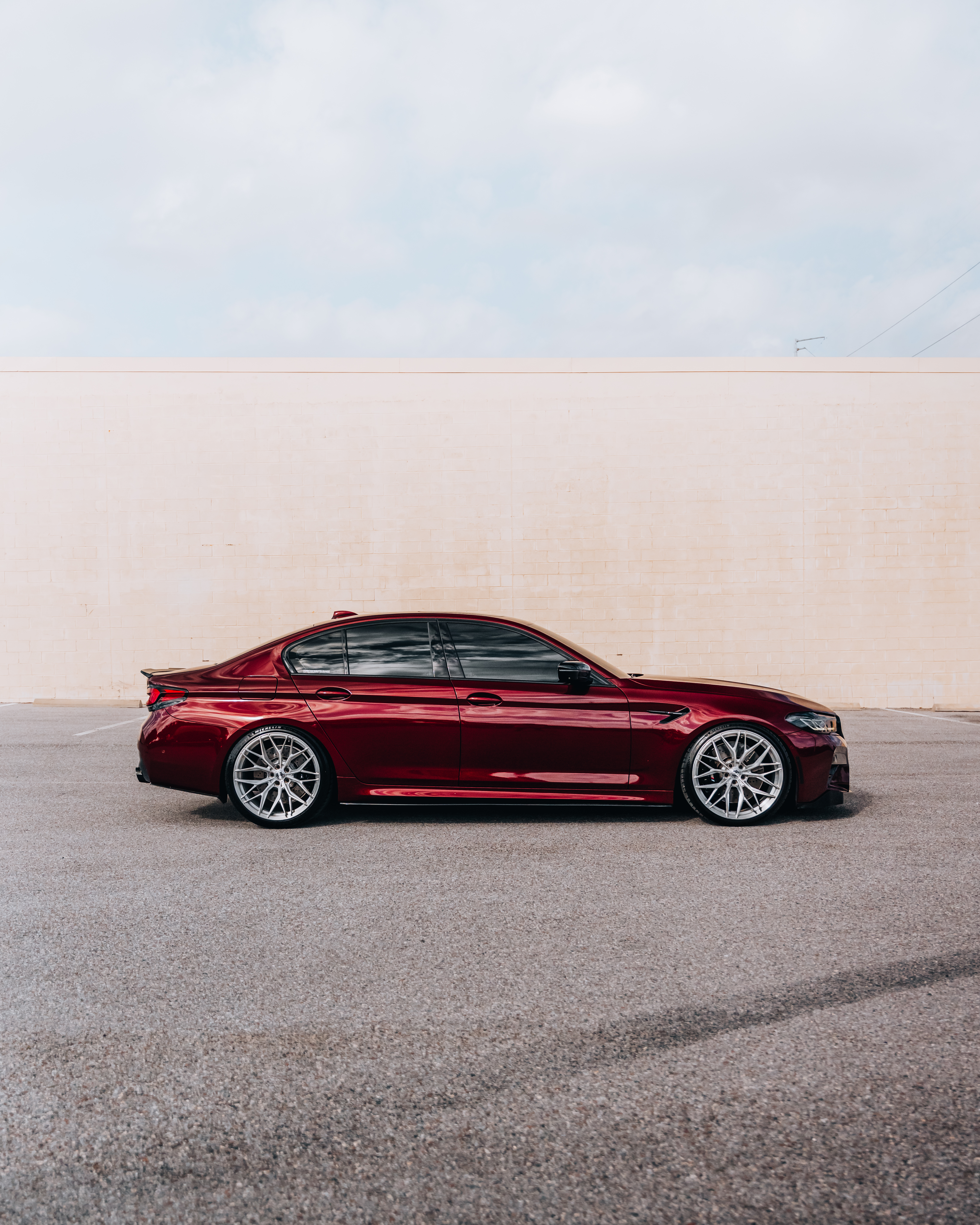 F90 BMW M5 LCI with Motivo Forged MB-E custom wheels in gloss brushed clear finish side view