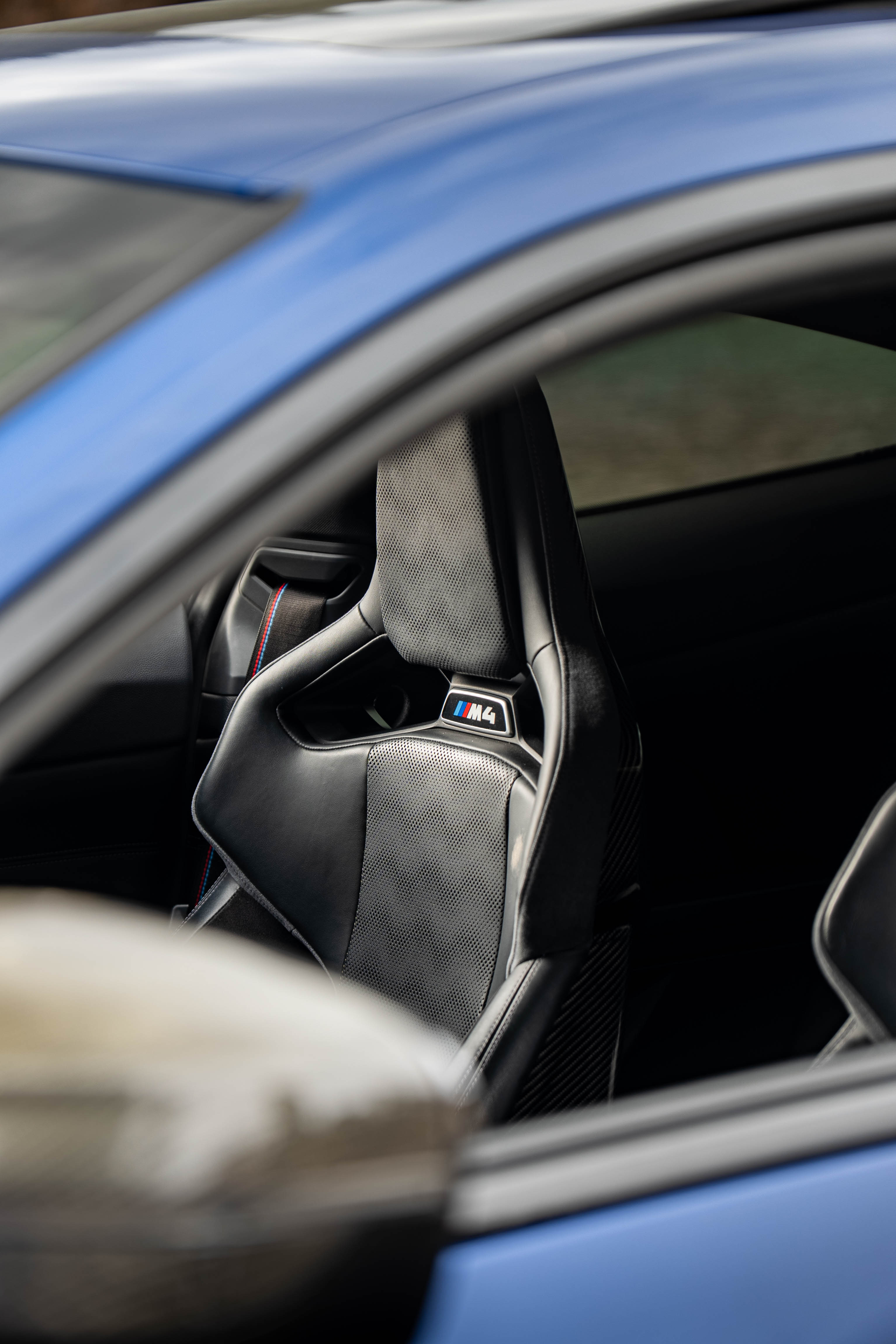 G82 BMW M4 with Motivo Forged MB-E custom wheels in gloss polished clear finish front seat view