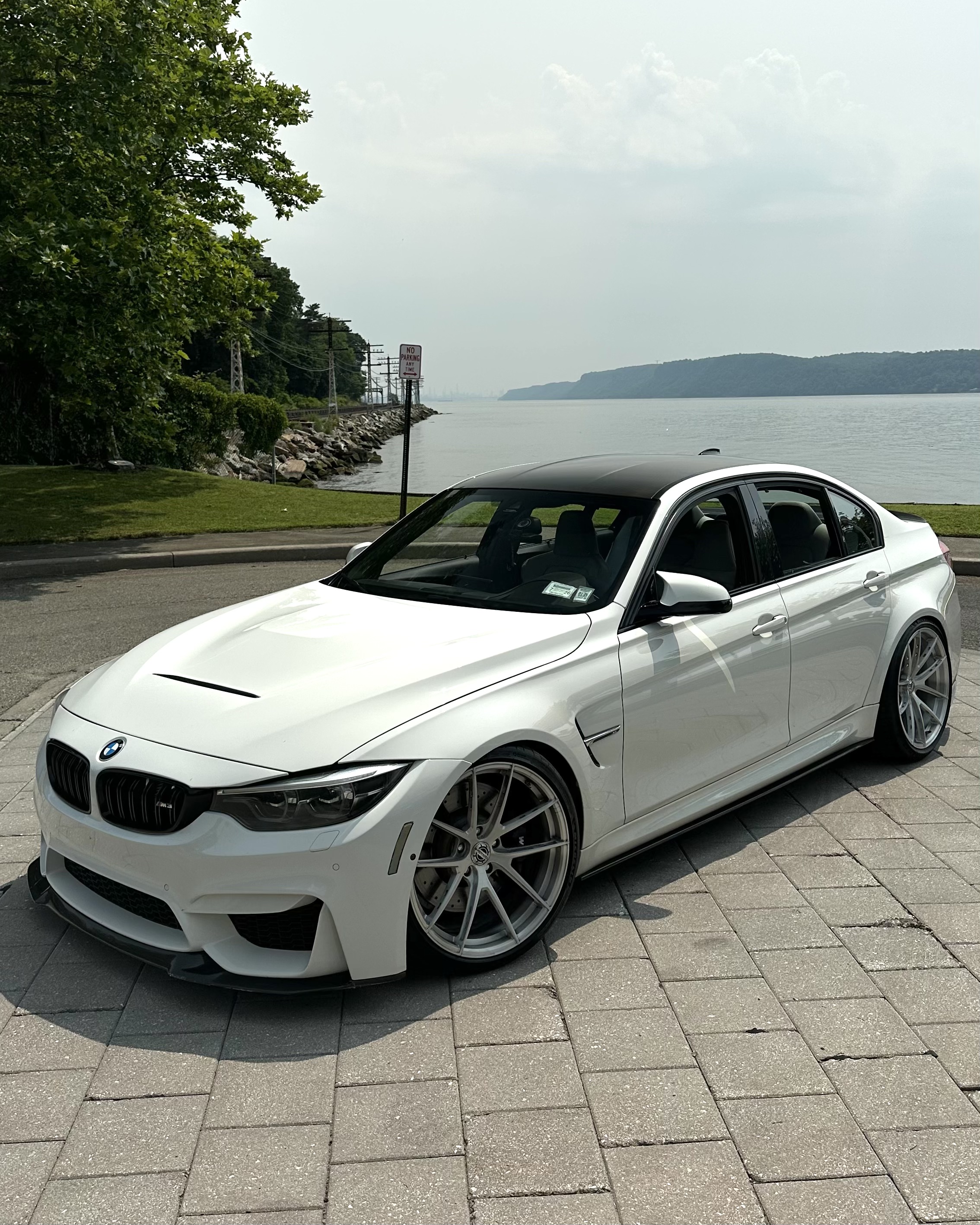 F80 BMW M3 with Motivo Forged MB-K custom wheels in gloss brushed clear finish front high side view