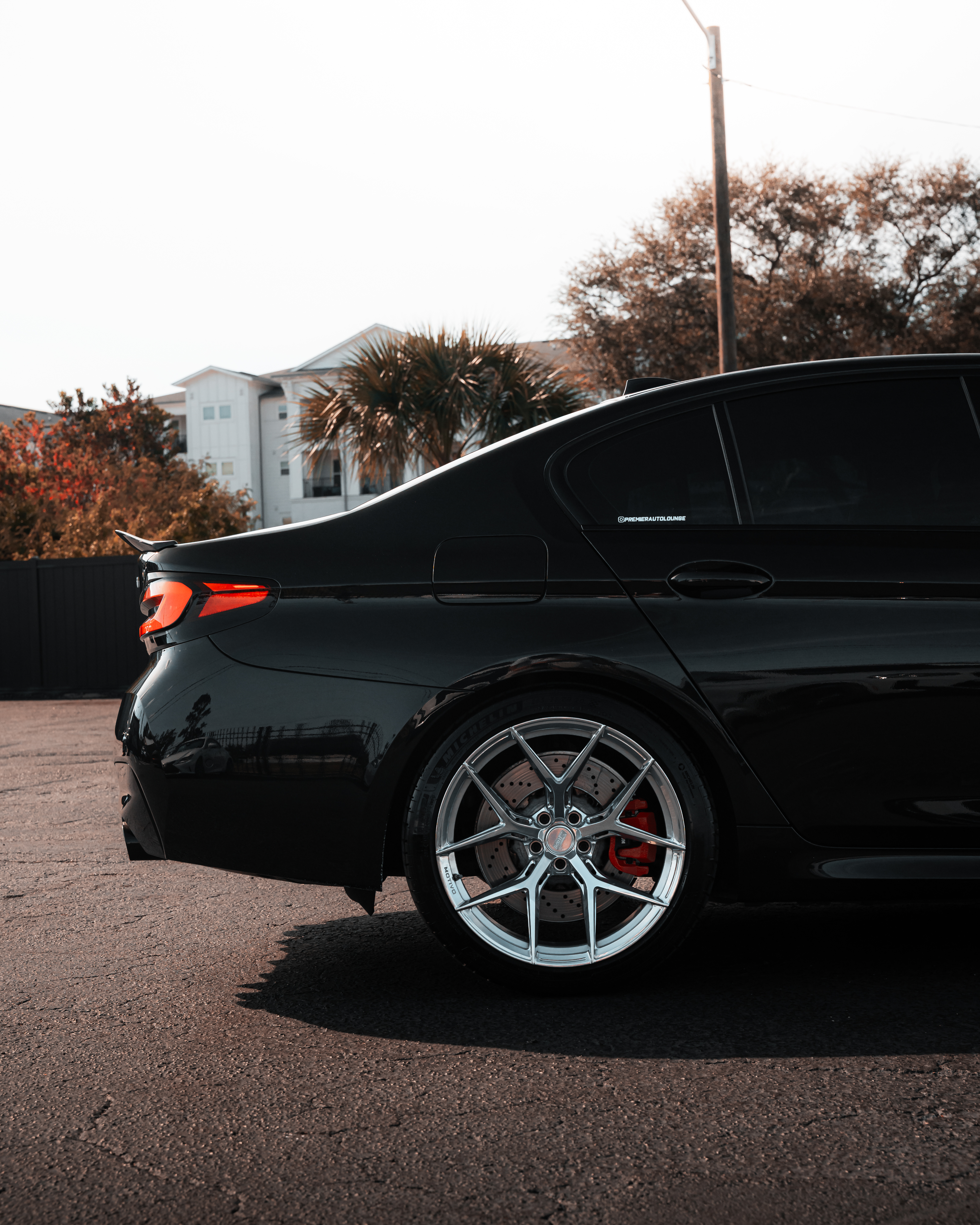 F90 BMW M5 LCI with Motivo Forged MB-H custom wheels in gloss polished clear finish rear corner view