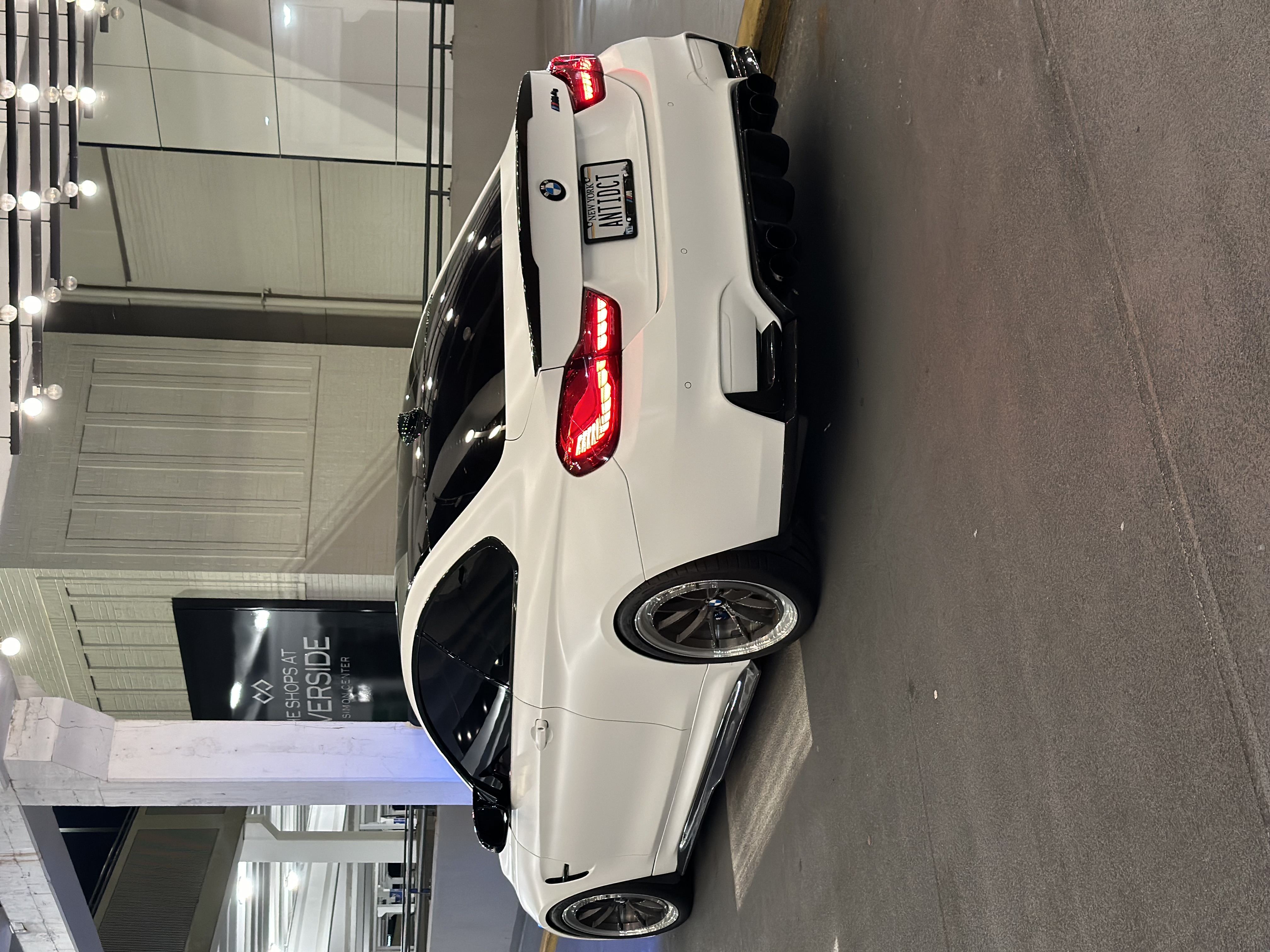 BMW M4 F82 with Motivo Forged MB-C Comp Spec custom wheels in gloss brushed gunmetal face and gloss polished clear lip rear side view