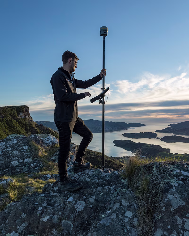Man holding an R12i Trimble receiver