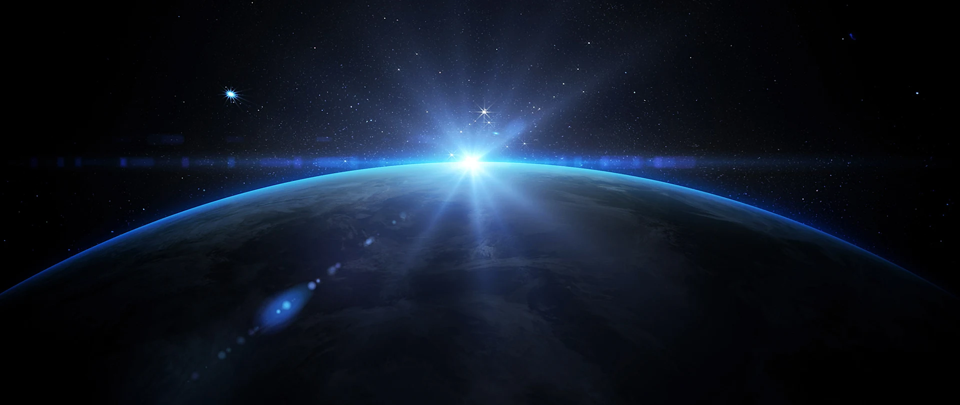 Viewing the sun rising over earth from space