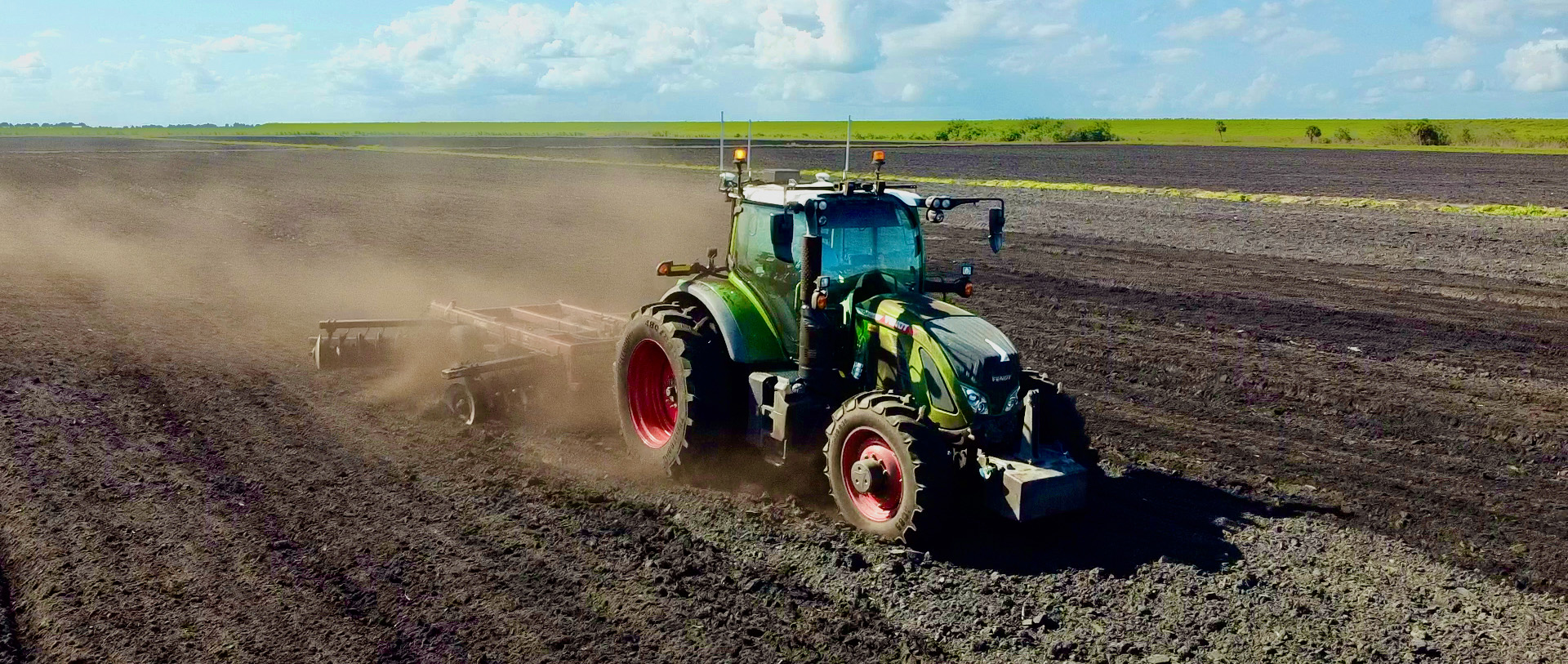 tractor tilling a field