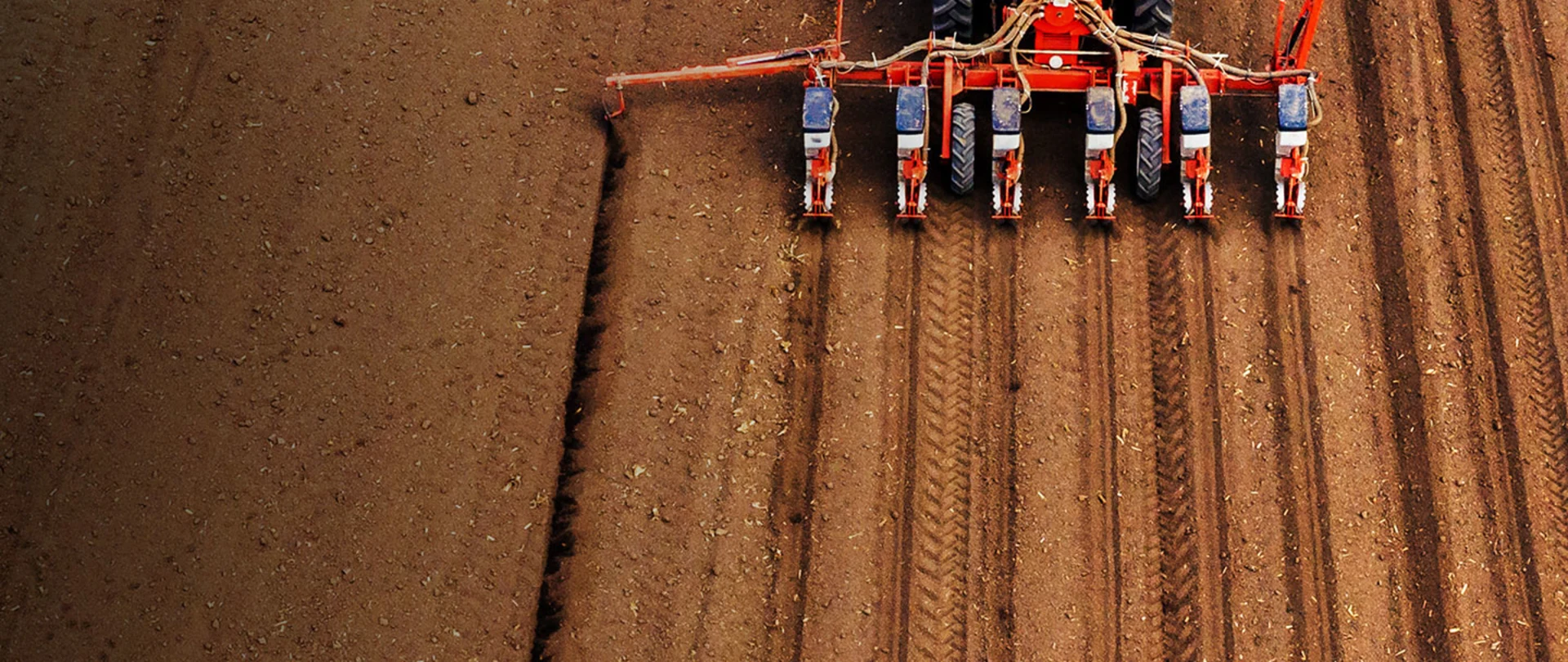 Tractor tilling soil