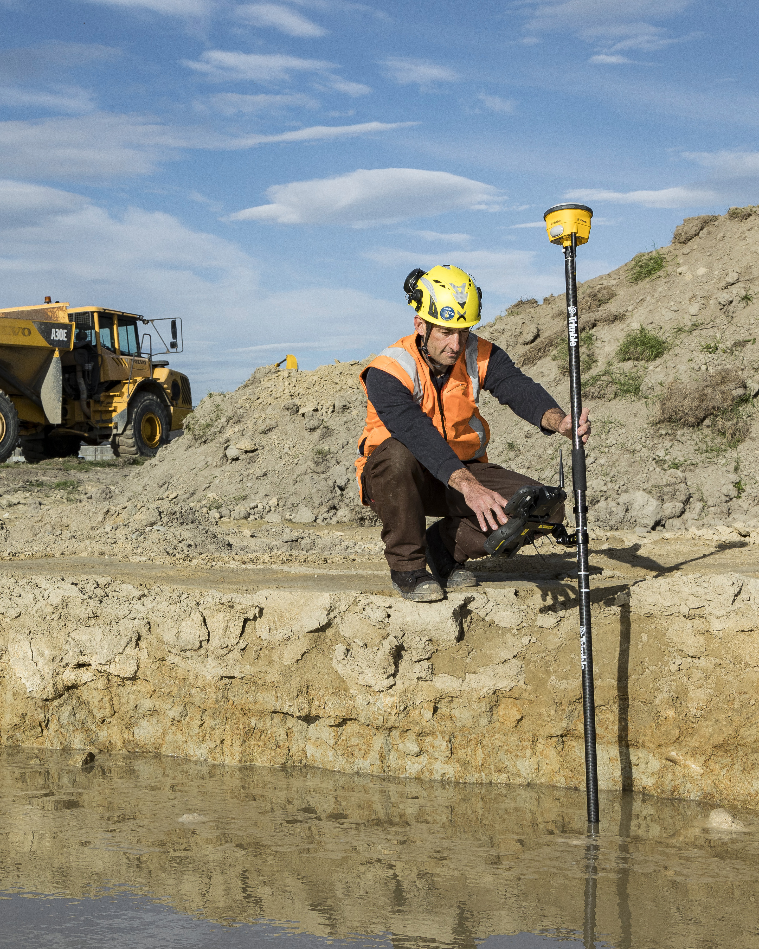 man using a Trimble R780 to measure