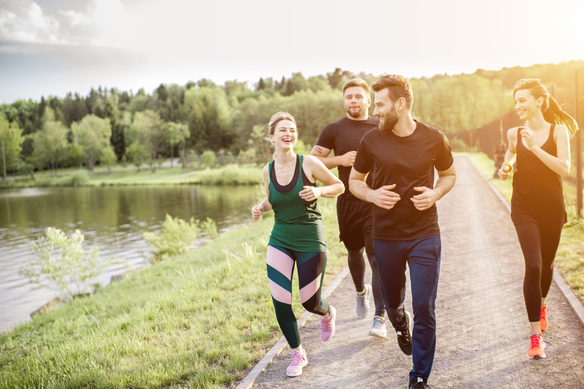 people-running-beside-a-lake-i-screen