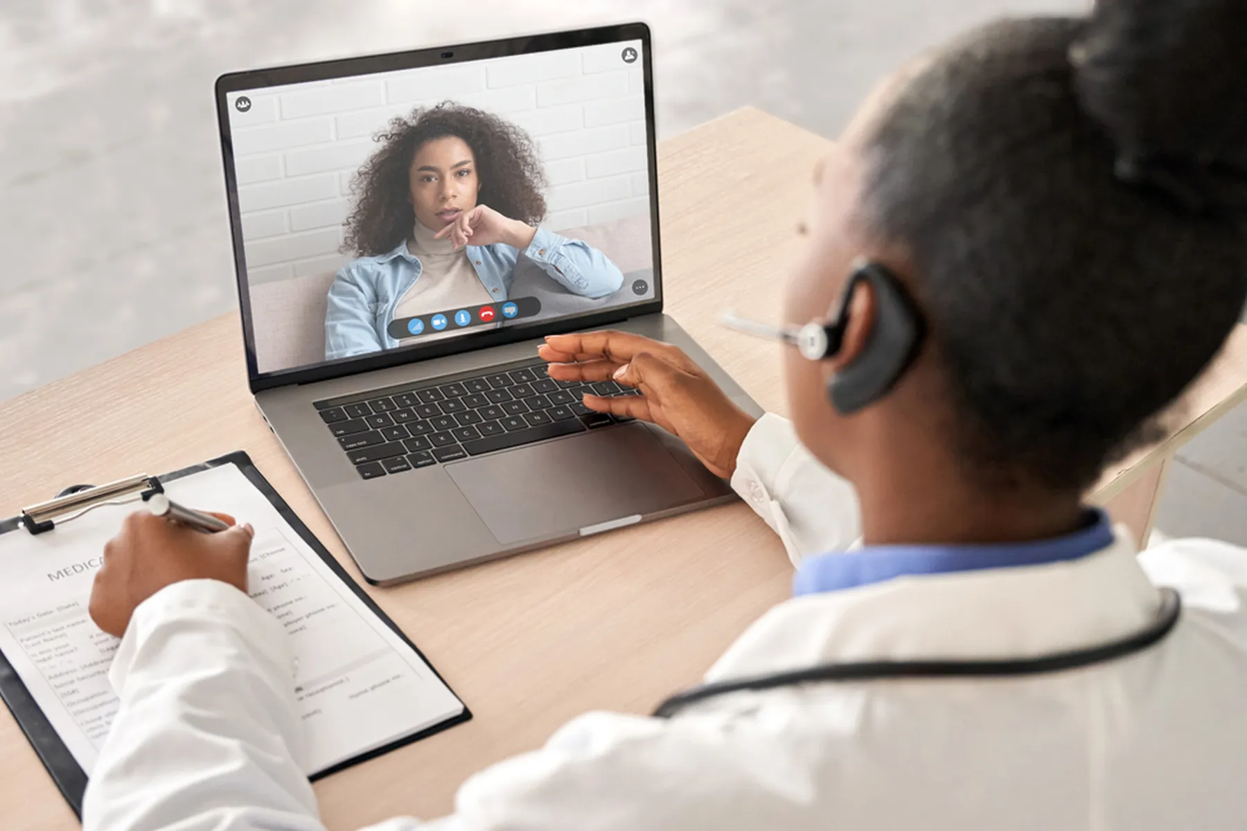 A doctor is conducting a telehealth appointment with a patient.