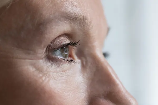 Close up of older woman's eye.