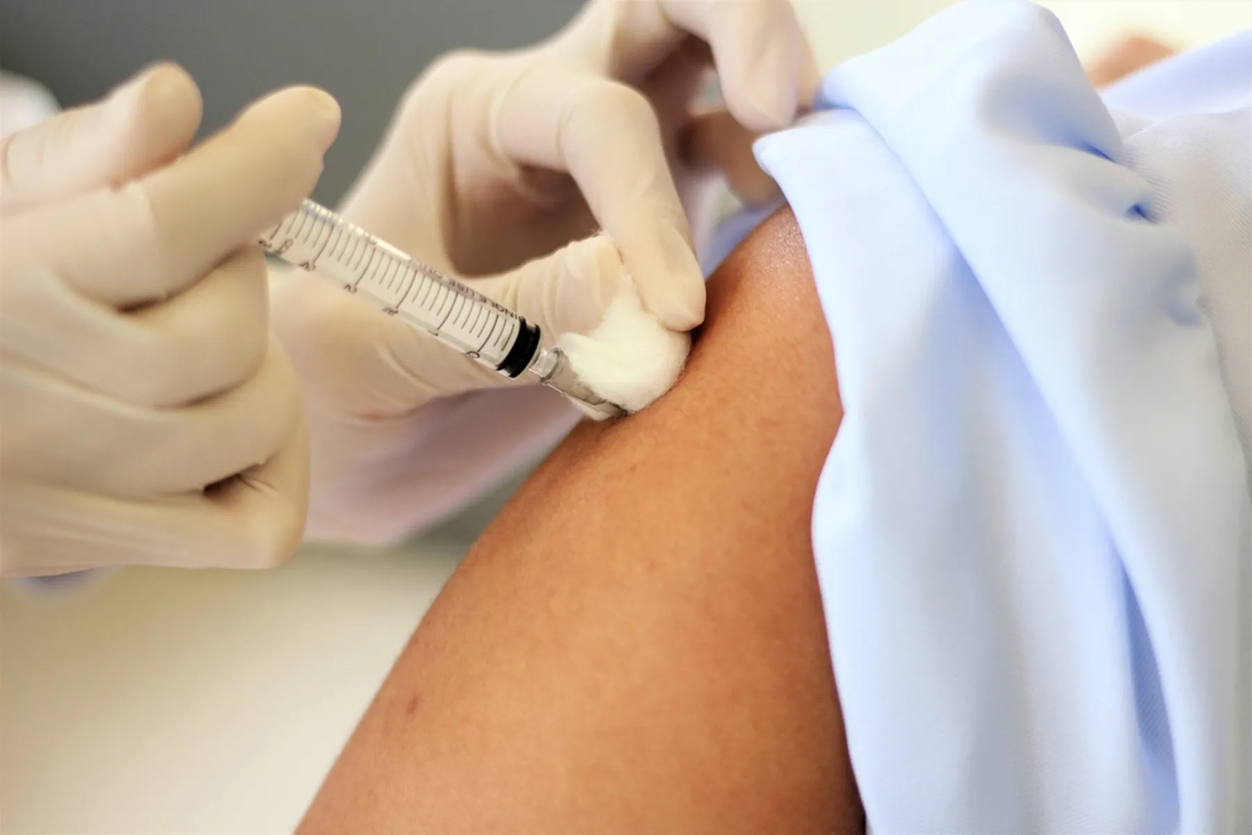 A person receives a flu shot.