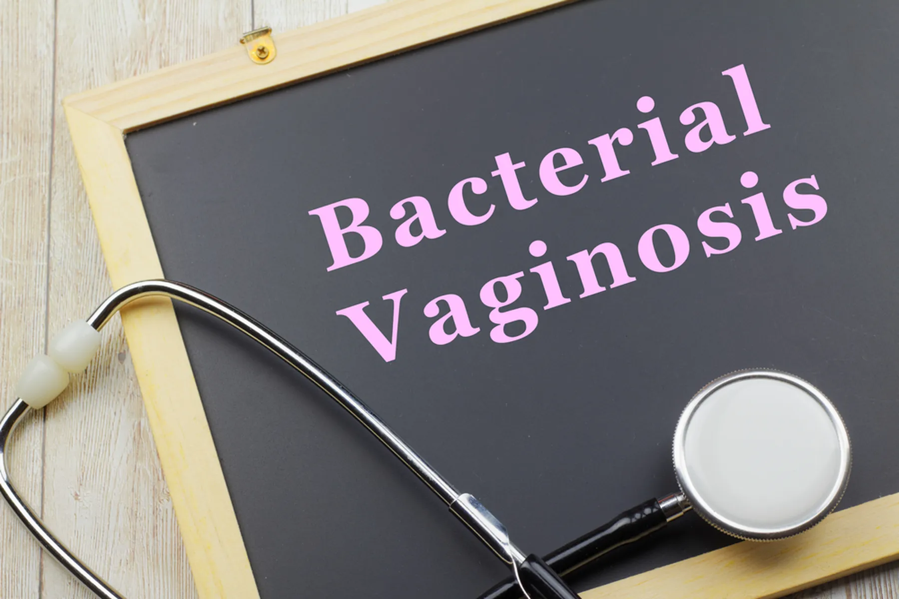 A chalk board with a stethescope that says Bacterial Vaginosis