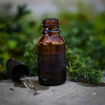 A tea tree oil bottle with dropper.