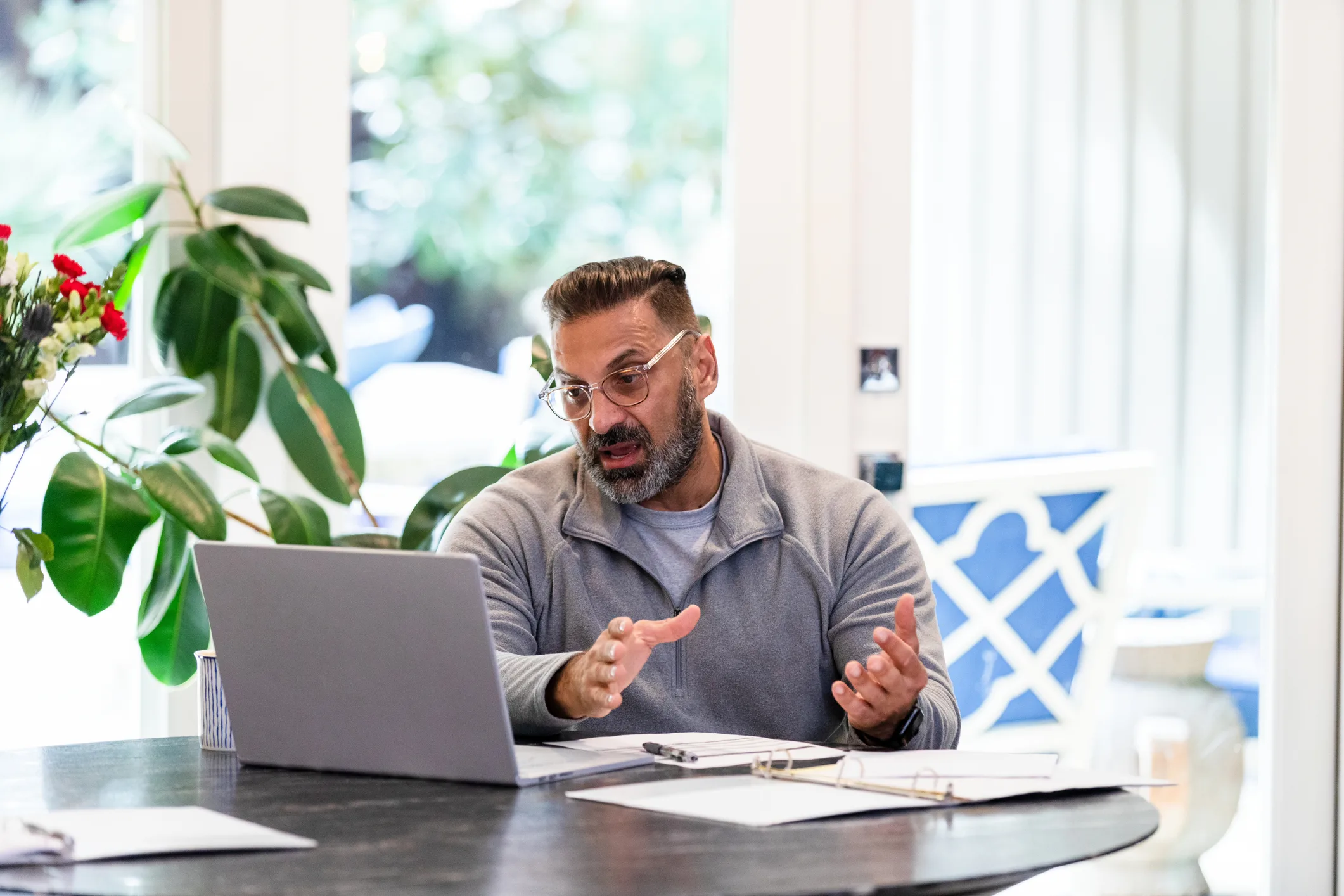 A male mortgage advisor talking on a video call