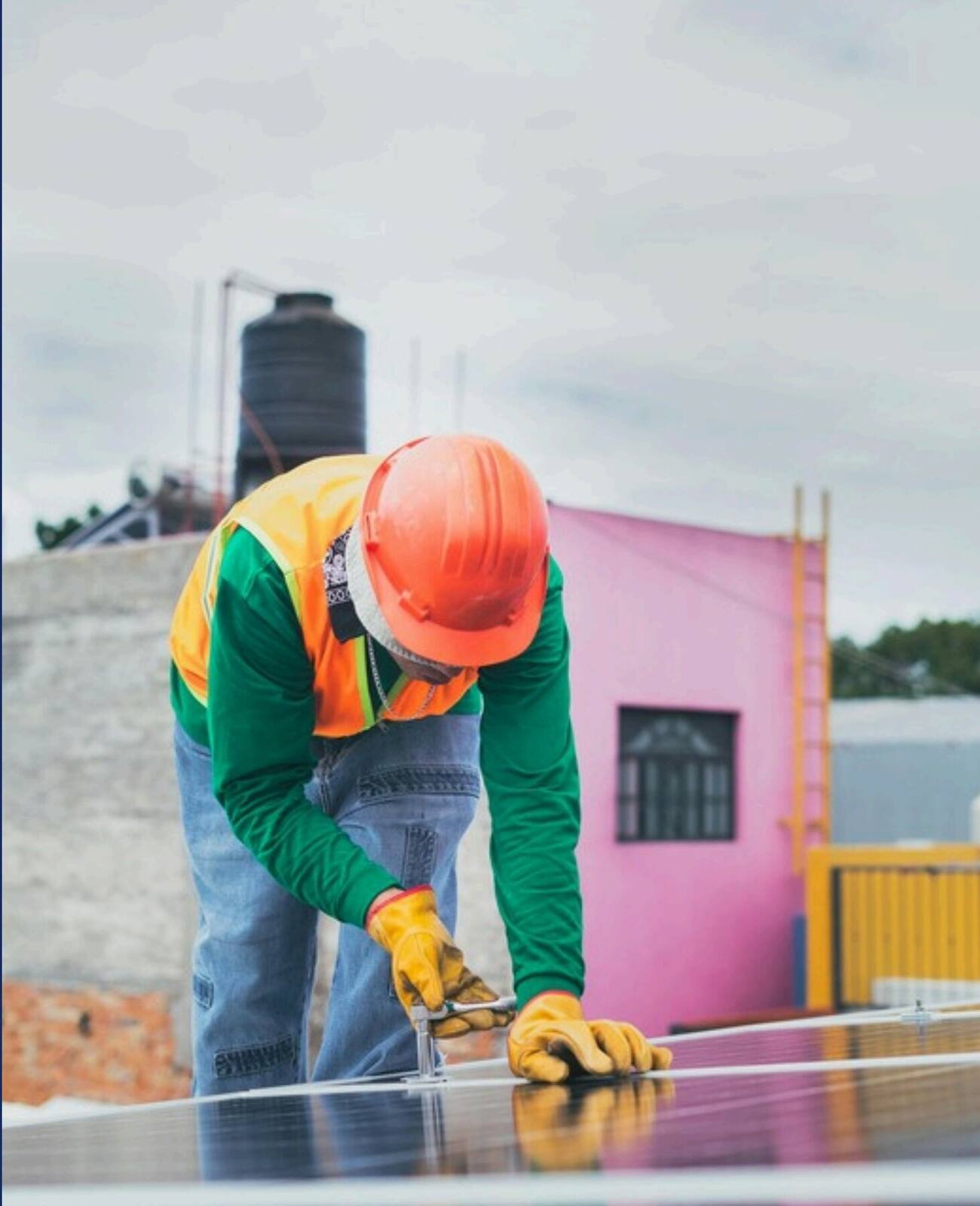 Worker installing solar panels