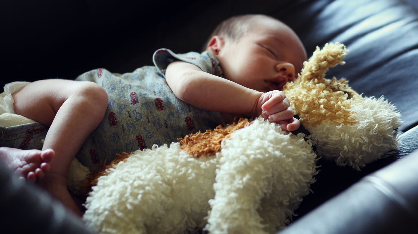 Newborn sleeping in crib right outlet away