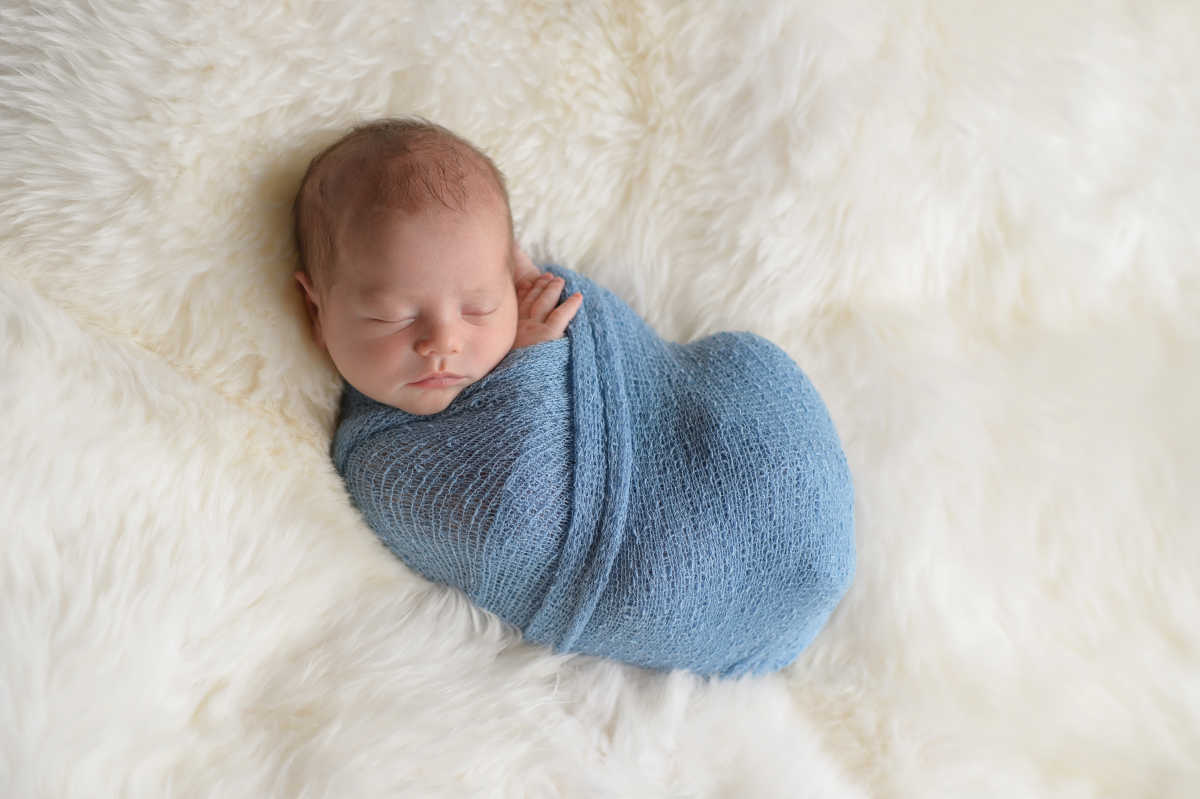 baby boy in blanket