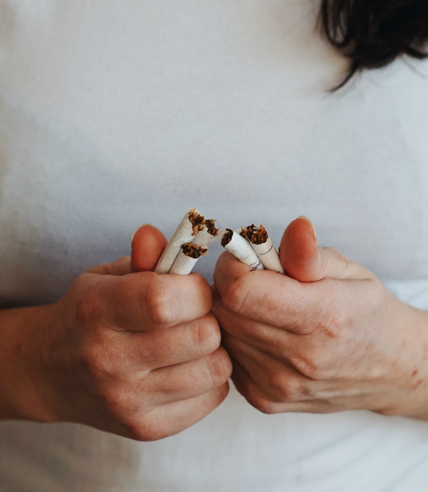 woman-breaks-cigarettes-in-half