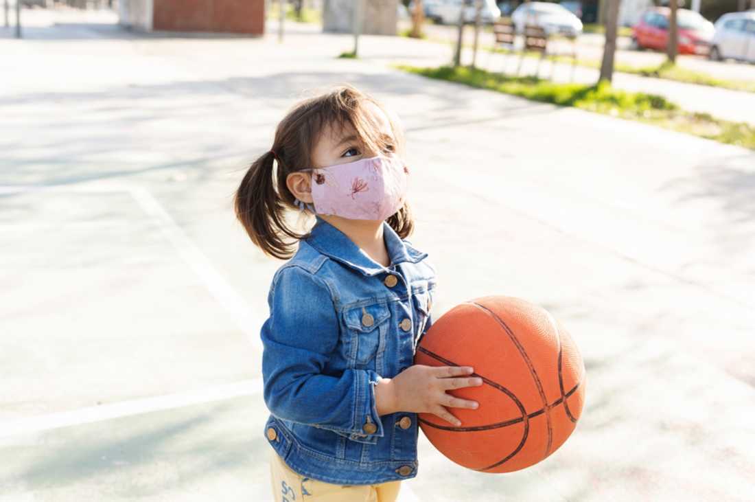 girl-in-mask-holding-basketball girl-in-mask-holding-basketball