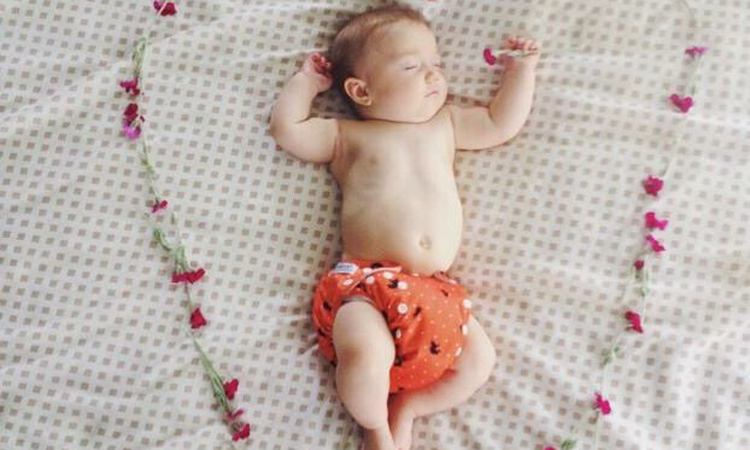 baby in cloth diaper