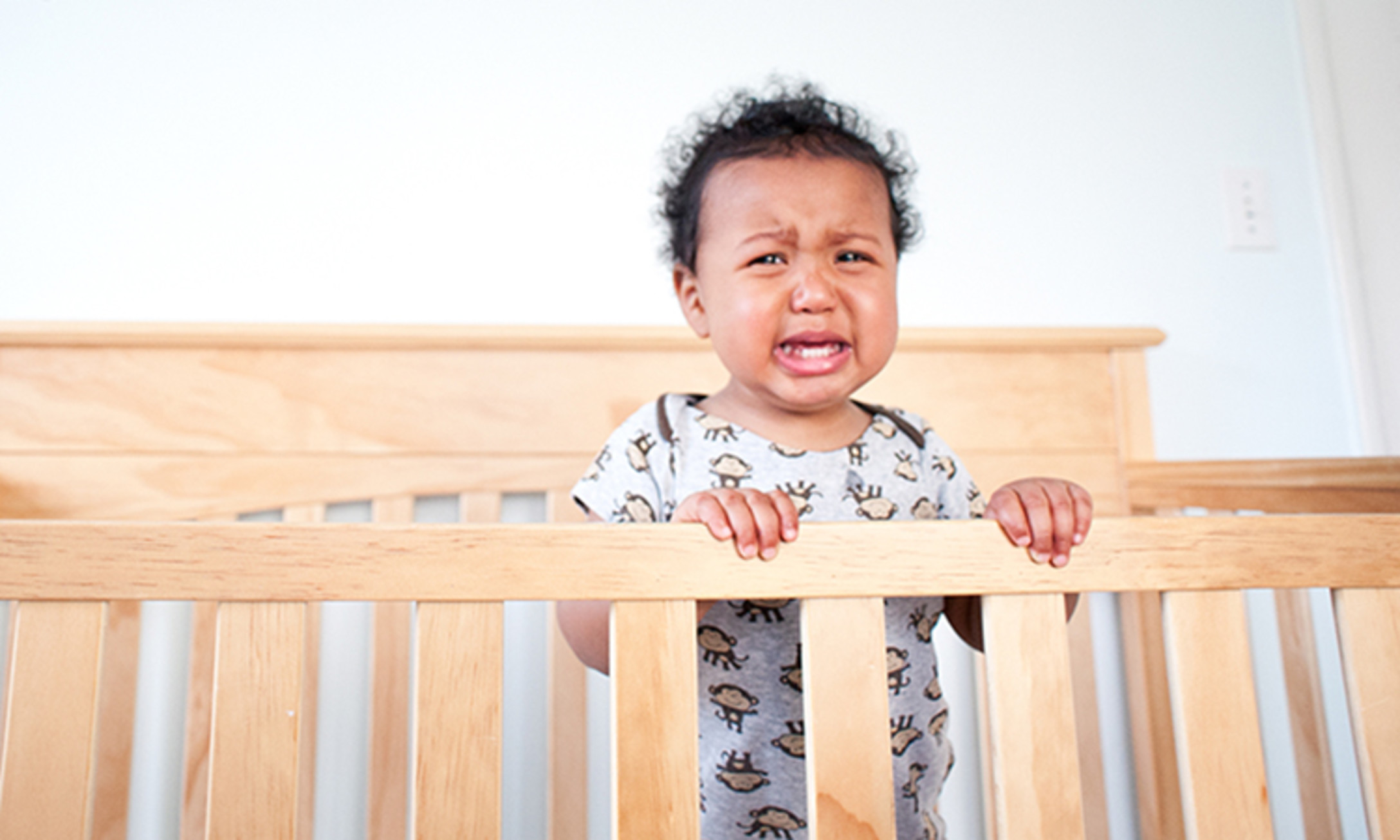 Baby keeps standing up deals in crib and crying