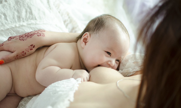 mom breastfeeding baby