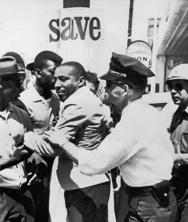 civil rights movement - Mandatory Credit: Photo by Underwood Archives/REX/Shutterstock (4436543a) Greenwood, Mississippi: April 2, 1963 A policeman applies an arm lock on comedian Dick Gregory after he left the Leflore County Court House to help Negroes register to vote. VAR