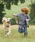 top-10-family-friendly-dogs13c - Boy playing with dog