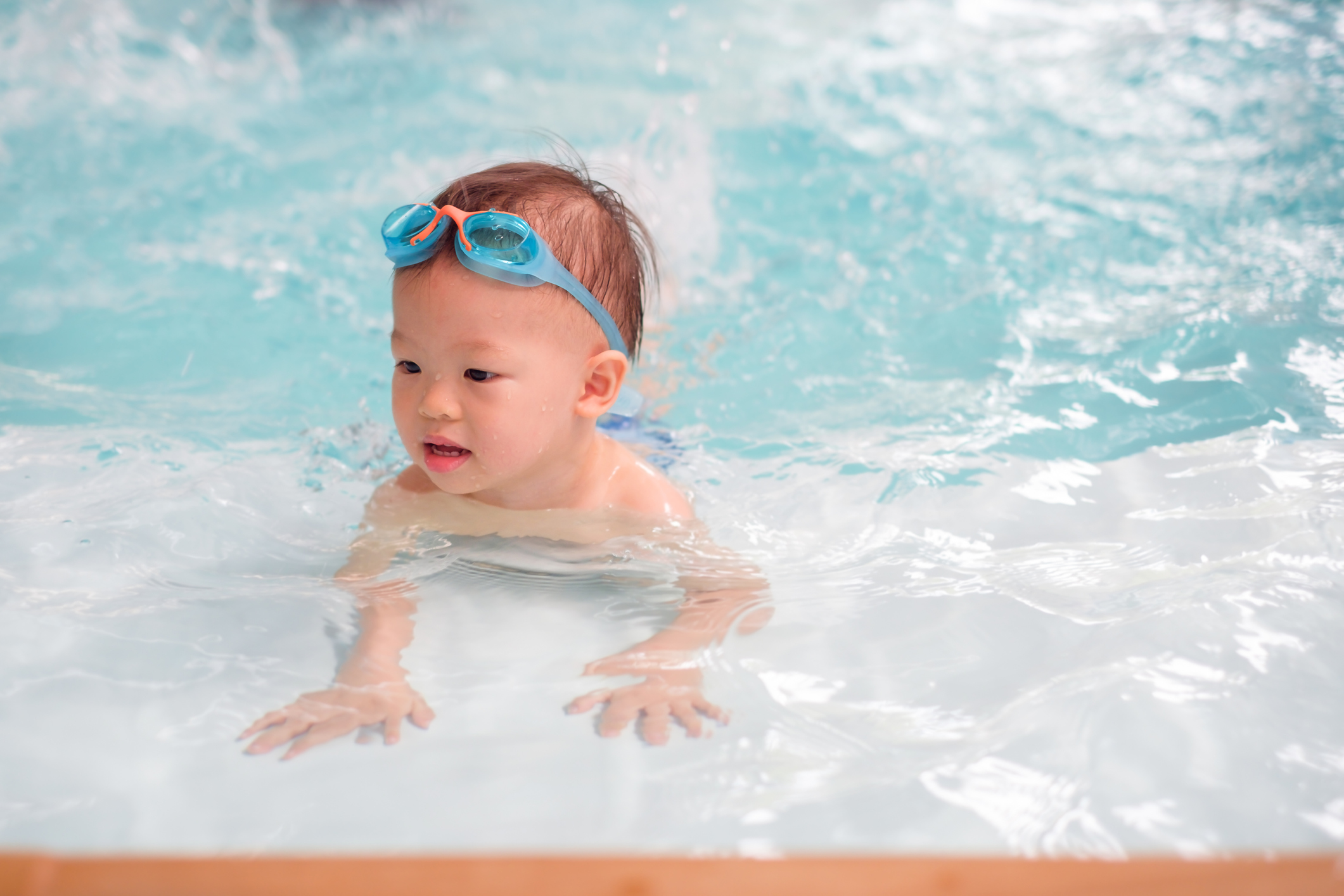 small boy swimming