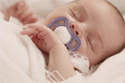 newborn sleeping with pacifier