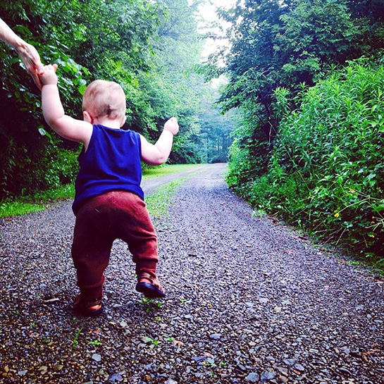 when do babies take their first steps