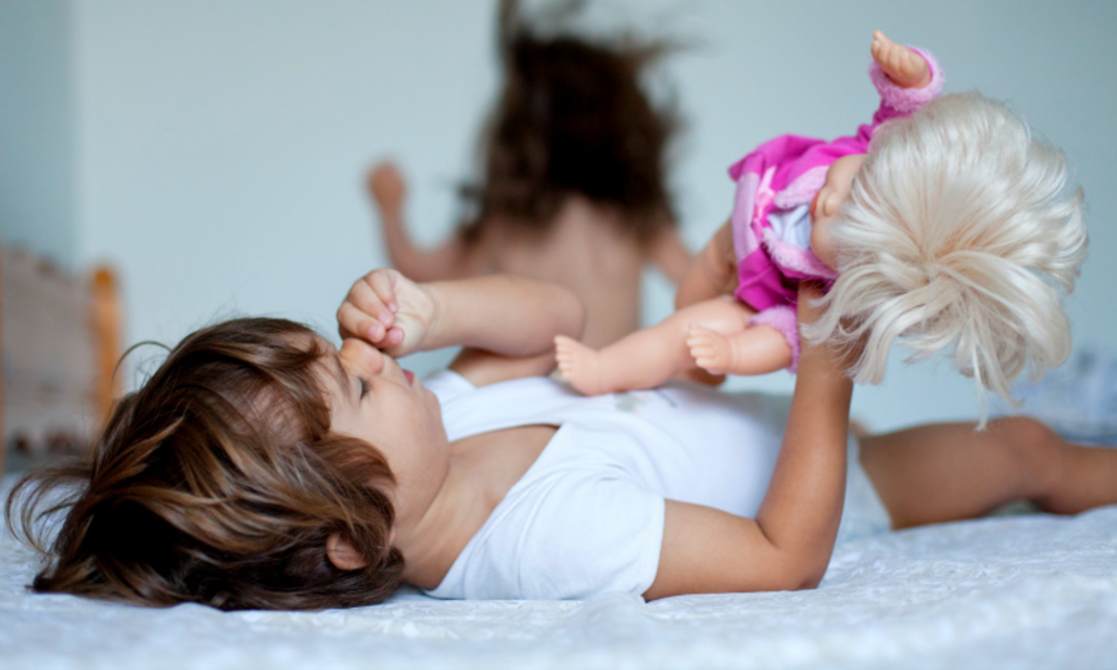 girls playing with dolls