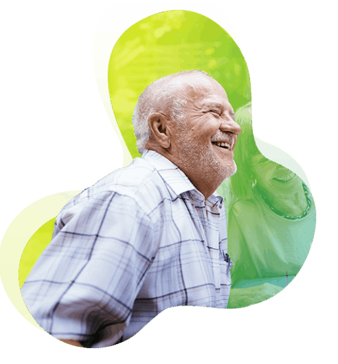 A smiling man with a grey beard.