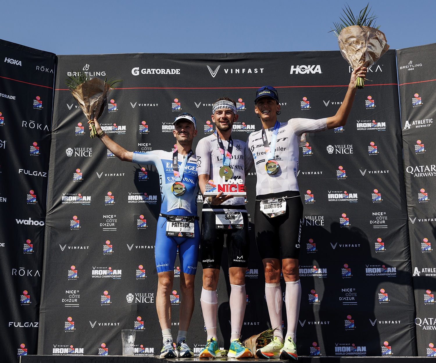 From left to right: Patrick Lange (2nd), Sam Laidlow (1st) and Magnus Ditlev (3rd) on the Ironman World Championships podium. Photography: Jan Hetfleisch / Getty Images / Ironman