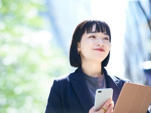 smiling woman with devices