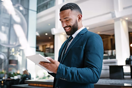 man working in hotel with tablet