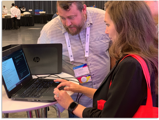 Twilio Signal Conference attendees using Docusign Dev Lab in the Docusign booth