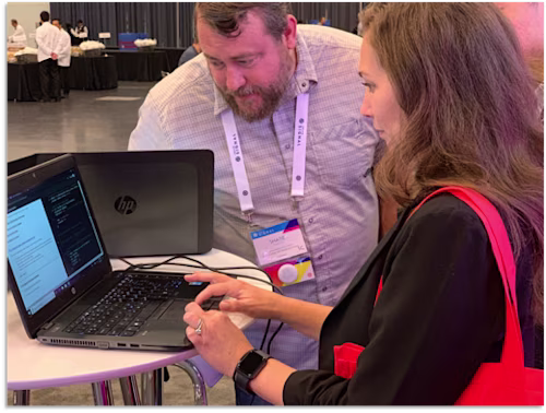 Twilio Signal Conference attendees using Docusign Dev Lab in the Docusign booth