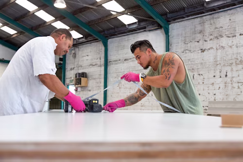 Manual workers together in a warehouse